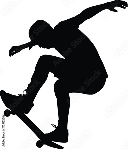 Skateboarder performing trick silhouette action sport