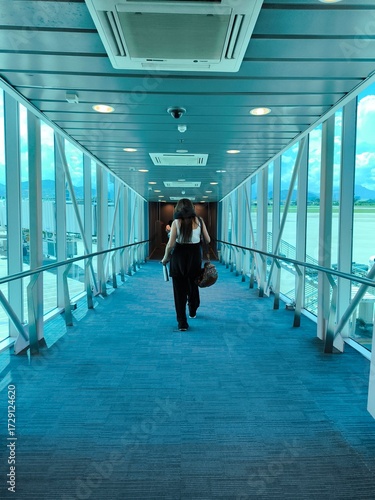 Wallpaper Mural Passenger Walking Through Modern Airport Jet Bridge towards Aircraft Torontodigital.ca