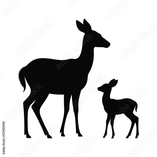 Silhouette of a mother deer standing protectively beside her young fawn