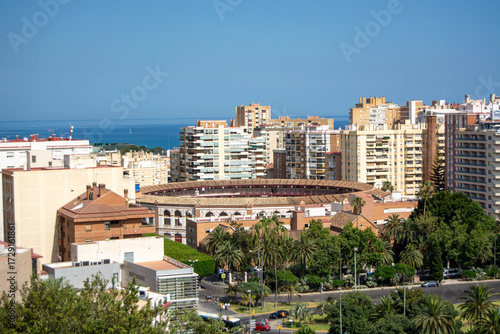 Aerial view of a bullring in a coastal city