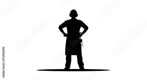 Confident carpenter with tools stands proudly ready for woodworking projects in clean studio