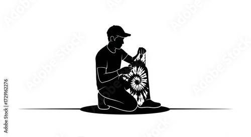 Young skateboarder in cap preparing dynamic tie-dye board for action