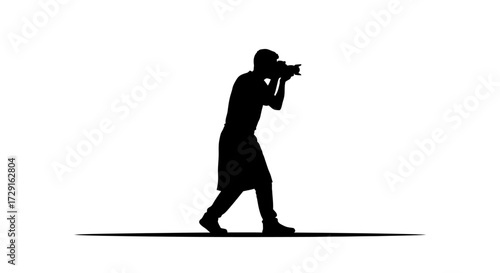 Dynamic silhouette of a photographer capturing a moment with professional camera