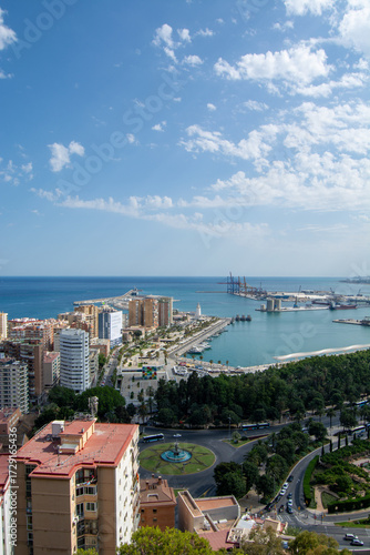 Coastal cityscape with marina and clear blue sky