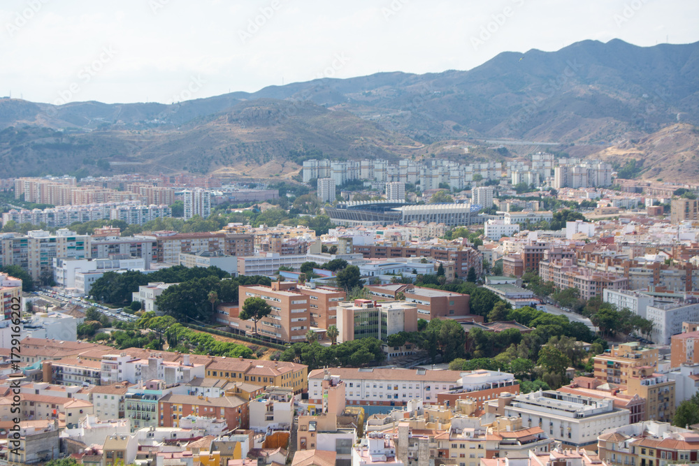 Obraz premium Aerial Cityscape with Mountain Backdrop