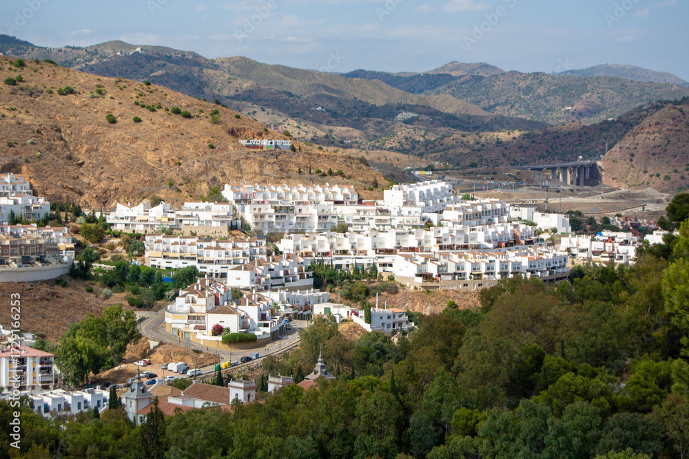 Fototapeta premium Aerial View of Mediterranean Village in Hilly Landscape