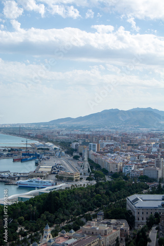 Panoramic view of a coastal city with mountains