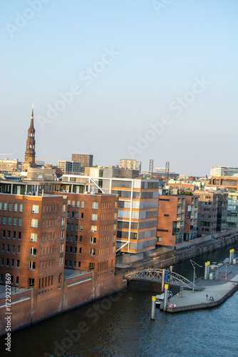 Scenic city waterfront with modern buildings and tower