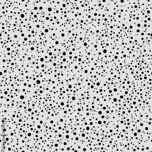 seamless polka dot pattern. tiny black repeat dots design with random sized circles on light gray background  for fabric prints, wallpaper and surface decoration
