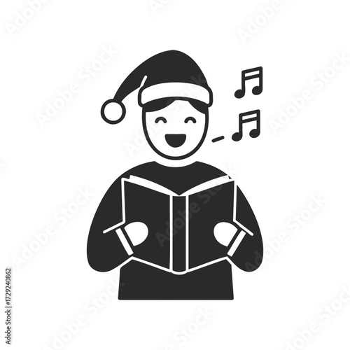 Silhouette of a young caucasian male singing christmas carols with book and santa hat