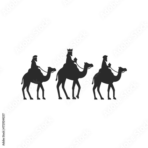 Silhouette of three wise men on camels journeying in a desert