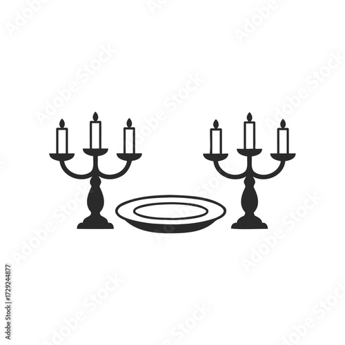 Elegant dinner setting with candelabras and plate icon