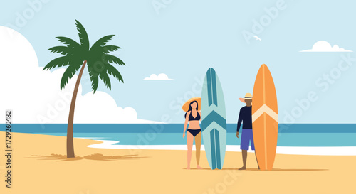 A couple stands on a sandy beach with surfboards next to a palm tree and the ocean.