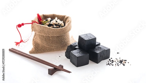 Dark food cubes and grains in a burlap bag