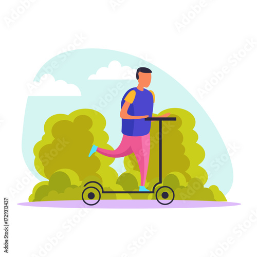 Young man enjoying a ride on his push scooter through a green city park on a sunny day