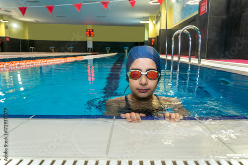 Portrait of elementary school girl in pool