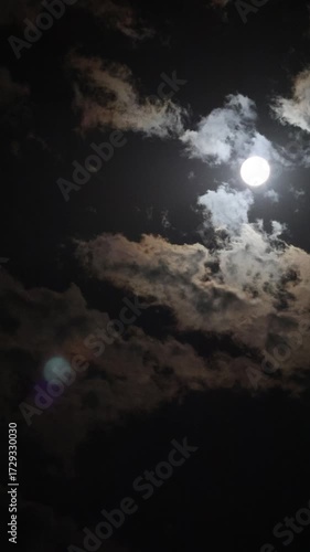 Timelapse of the moon setting behind the clouds