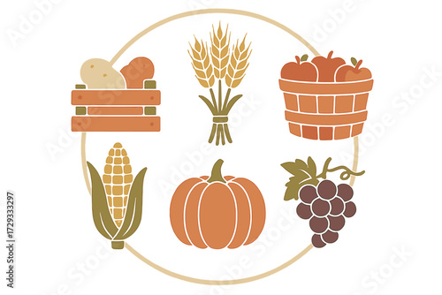 Variety of fresh autumn harvest produce arranged in a circular design with potatoes, wheat, apples, corn, pumpkin, and grapes