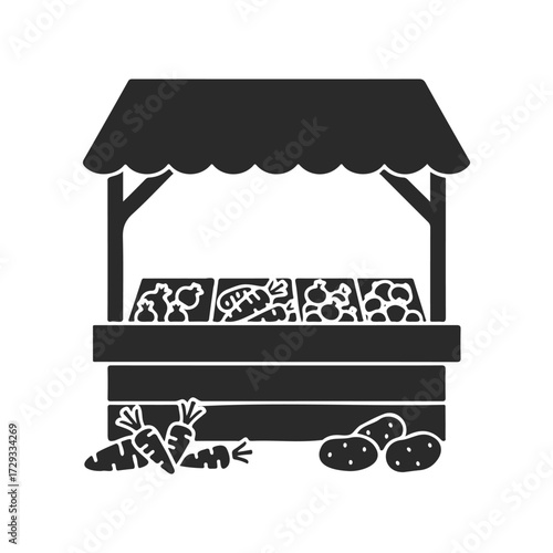 Silhouette of farm stand with vegetables displayed on counters and ground