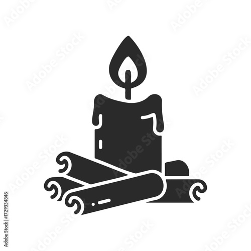 Silhouette of a lit candle with scrolls on a white background