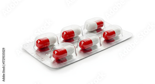 Blister Pack of Red and White Capsules on White Background.