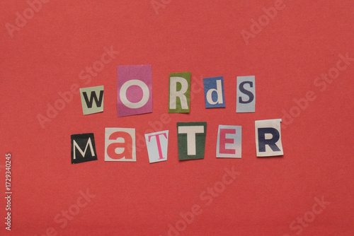 Words matter message spelled using cut out newspaper letters
