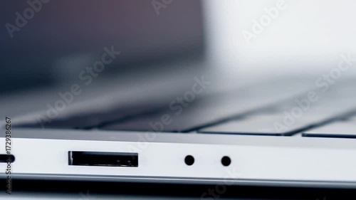 Wallpaper Mural Close-up view of a laptop's ports showcasing connectivity options in a modern workspace Torontodigital.ca