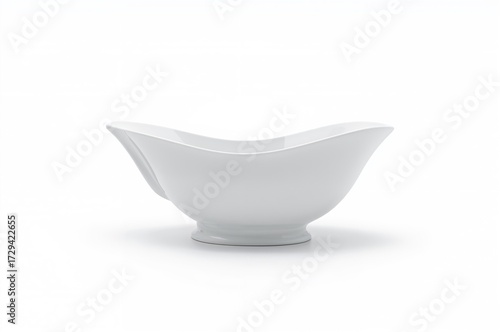Traditional style clean sauceboat on a white backdrop. Close-up studio shot.