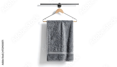 Gray towel hanging on a metal rod