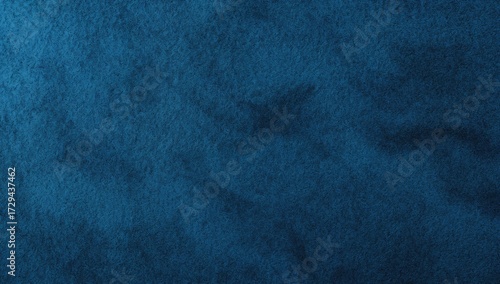 Abstract background of blue felt fabric texture with dark vignette and space for text
