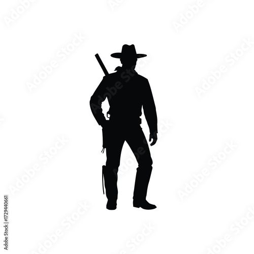 Silhouette of a cowboy with a rifle and hat standing confidently