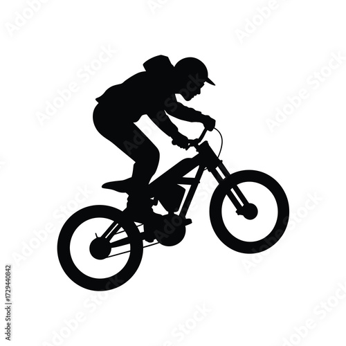 Dynamic silhouette of a motocross rider performing a wheelie on a bicycle