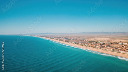 Wallpaper Mural Breathtaking aerial view captured by drone featuring a coastal town and vibrant turquoise sea, embodying vacation and travel themes Torontodigital.ca