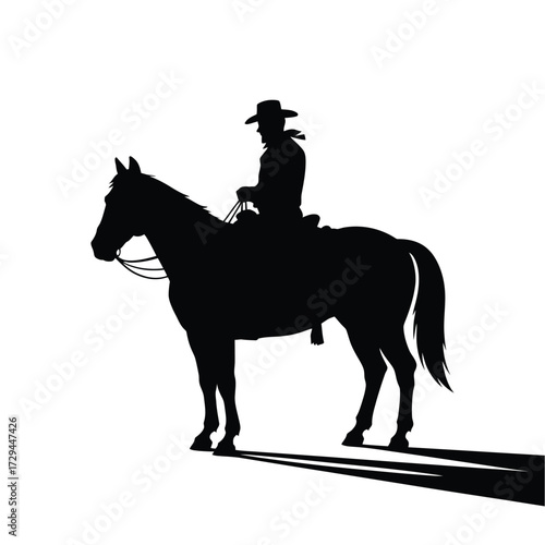 Striking silhouette of a cowboy on horseback casting a long shadow