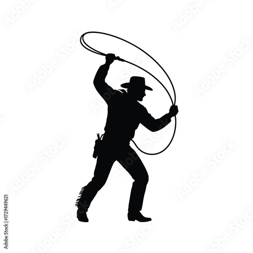 Silhouette of a cowboy in action swinging a lasso ready for the rodeo