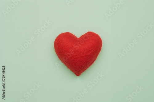 Wallpaper Mural Crafted plush felt heart set against a green backdrop Torontodigital.ca