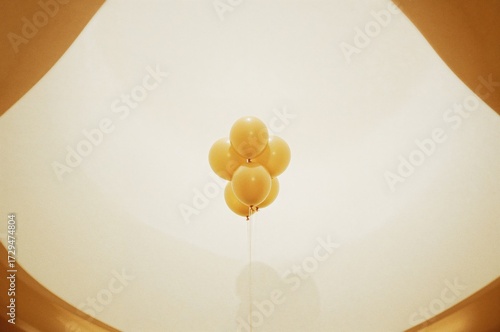 Shiny gold balloons arrange...