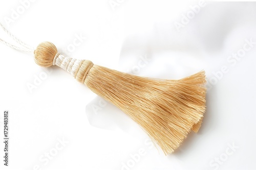 Isolated golden silk tassel...