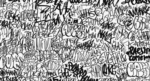 An Intricate Overlap of Black and White Graffiti Tags Filling the Entire Frame with a Dense Urban Artistic Expression