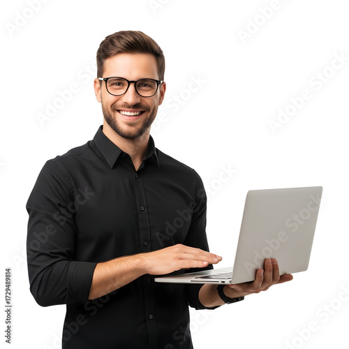 Smiling man wearing glasses and a black shirt holding a laptop and looking at the camera with a white background