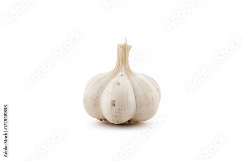 Single Garlic Clove on a Wh...