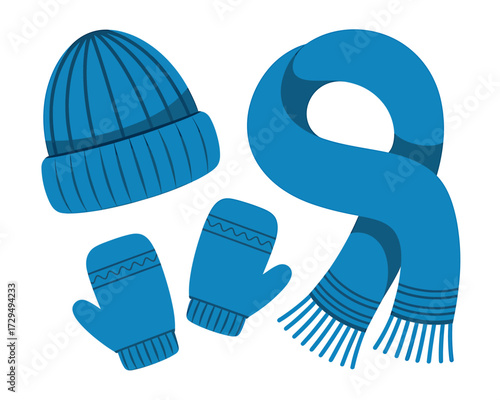 Blue winter clothes isolated on white background including hat, scarf, mittens