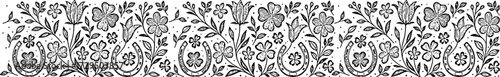 Floral pattern with horseshoes in monochrome design with intricate details