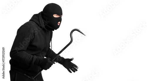 Fotografie Portrait of disguised looter holding crowbar and looking at copy space, isolated