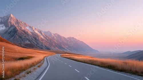 Long Straight Highway Road with Cinematic HDR Landscape at Sunset Featuring Mountains with Snowy Peaks and Golden Fields under Sky in Hdr
