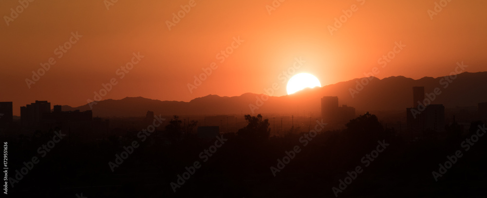 Fototapeta premium Sunset Over City Skyline and Mountains - 2