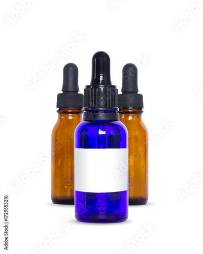 Blue glass dropper bottle with blank label in front of two amber bottles, ideal for essential oils, skincare, natural cosmetics, or aromatherapy packaging.