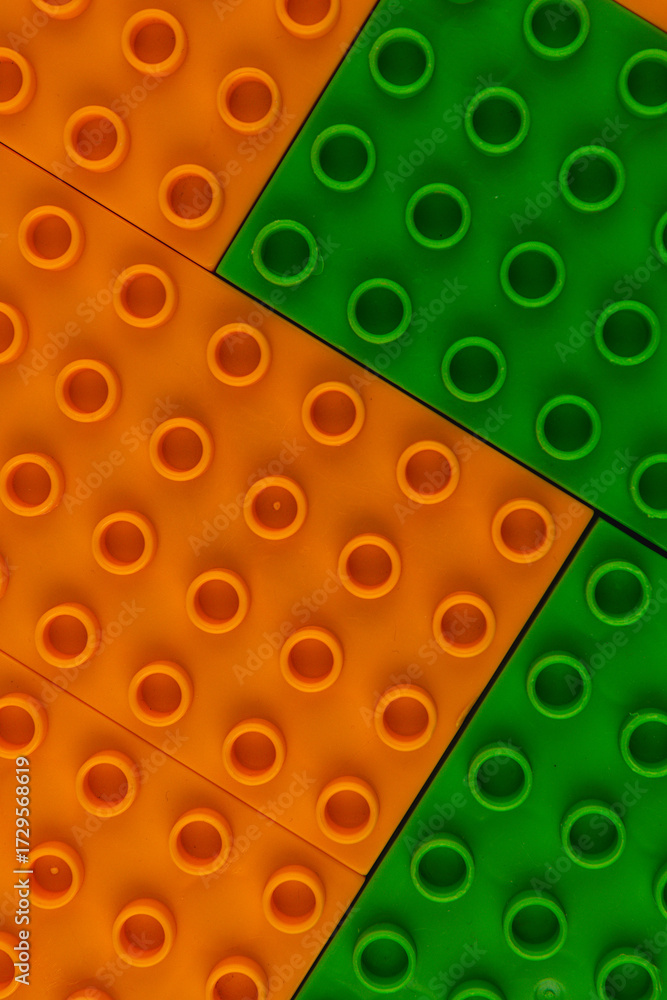 Fototapeta premium Colorful Lego bricks arranged on a surface for creative building