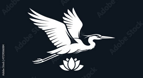 Elegant white heron in flight above a blooming lotus flower.