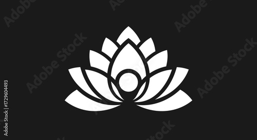 Elegant white lotus flower symbol of purity and enlightenment on black background.